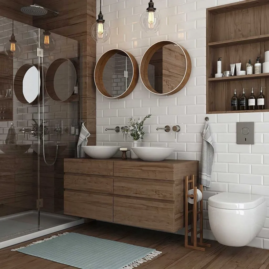 Ahşap lavabo dolabı, yuvarlak aynalar ve cam duş alanıyla tasarlanan modern banyo renderı