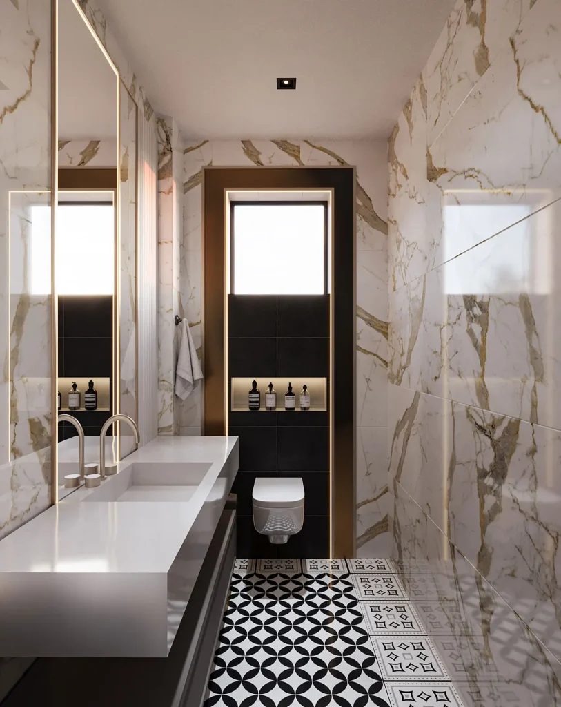 Mermer duvarlar, desenli zemin, asma klozet ve modern lavabo tezgâhıyla tasarlanan zemin kat WC