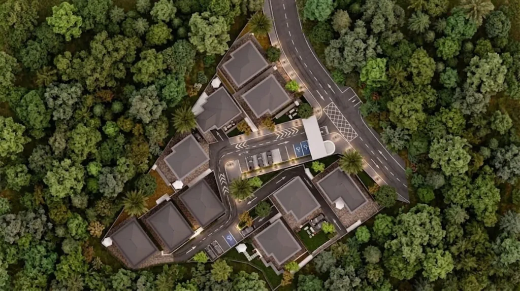 Ormanlık alan içinde konumlanan villalar, site içi yollar, otopark alanları ve güvenlik girişini gösteren villa sitesi vaziyet planı